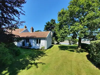 an old white house with a large yard at River View - Stunning estuary views in Aldeburgh