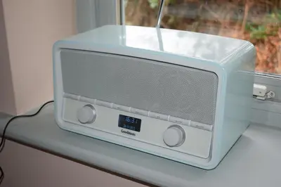 a small blue and white microwave sitting on a window sill at River View - Stunning estuary views in Aldeburgh