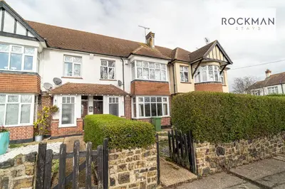 a brick house with a fence in front of it at 5 Bed Apartment Close To Beach with Off-street parking - Perfect for Contractors - Fast Wi-Fi - Close to beach in Southend-on-Sea