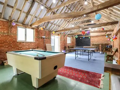 a room with a pool table in a building at The Brambles in Colchester