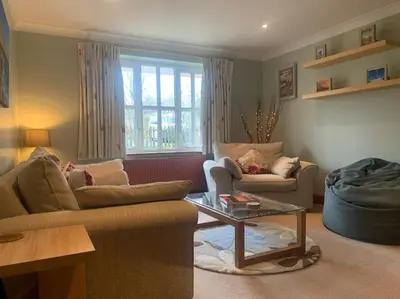 a living room with two couches and a coffee table at Rockhopper Cottage, Waldringfield in Woodbridge
