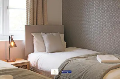 a bedroom with two beds and a window at 3 Bedroom House By Trinity Stays Short Lets & Serviced Accommodation Cambridge With Free WiFi & Parking in Cambridge