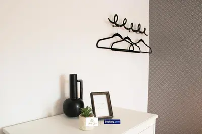 a room with a table with a mirror and a shelf at 3 Bedroom House By Trinity Stays Short Lets & Serviced Accommodation Cambridge With Free WiFi & Parking in Cambridge