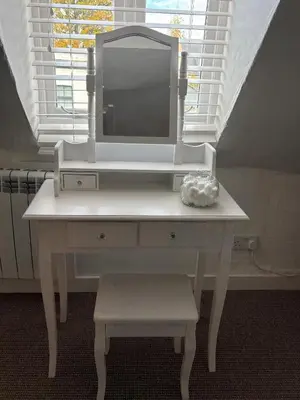 a white dressing table with a tv on top of it at Stylish Town House in Medieval Grid in Bury Saint Edmunds