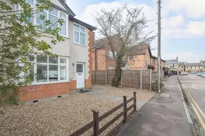 an image of a house with a fence at Charming Central Family Home in Cambridge