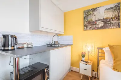 a kitchen with a counter top and a microwave at The Modern Cambridge Studio 3 in Cambridge