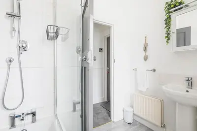 a bathroom with a shower and a sink at The Modern Cambridge Studio 3 in Cambridge