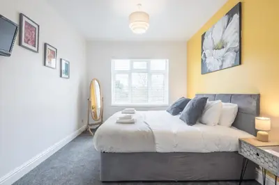 a bedroom with a bed and a window at The Modern Cambridge Studio 5 in Cambridge