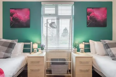 a bedroom with two beds and a window at The Modern Cambridge Studio 6 in Cambridge