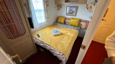 a small bedroom with a bed in a small room at Freedom House in Clacton-on-Sea