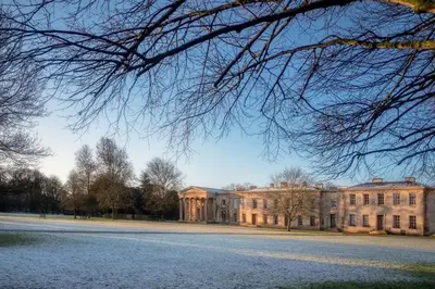 a large building with a road in front of it at Downing College in Cambridge
