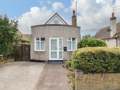 a brick house with a driveway in front of it at 21 Crossways in Clacton-on-Sea