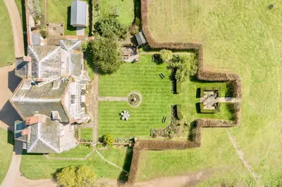 an aerial view of a house with a yard at Butley Priory in Woodbridge