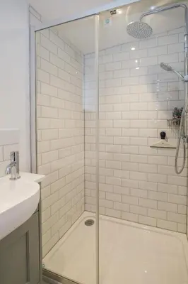 a shower with a glass door in a bathroom at The Lodge, Aldringham in Aldringham