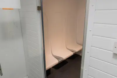 a bathroom with two pink urinals in a stall at 2 Bed Barn conversion in Tibenham