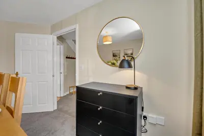 a bedroom with a black dresser and a mirror at The Grange Luxe2, 5 Bedroom House,Spacious,contractor,family,Internet,free parking,group,study,relocation,easily accessible in Ipswich,Kesgrave in Ipswich