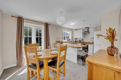 a kitchen and dining room with a table and chairs at The Grange Luxe3, 4 Bedroom House,5-beds,Spacious,contractor,family,Internet,free parking,group,study,relocation,easily accessible in Ipswich,Kesgrave in Ipswich
