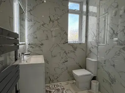 a bathroom with a toilet and a sink at Modern accomodation in Westcliff-On-Sea in Westcliff On Sea
