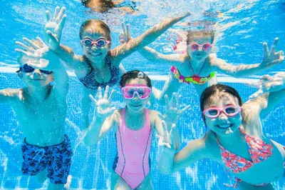 a group of children in a swimming pool at 4 Berth Caravan With Decking And Wifi At Carlton Meres In Suffolk Ref 60010K in Saxmundham