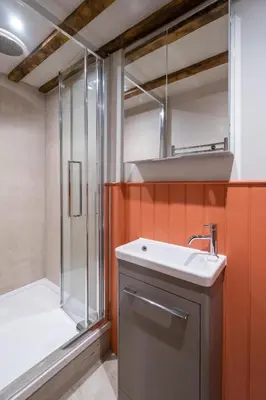a bathroom with a sink and a shower at Alde Bay Farm - Barn Owl Sanctuary in Aldeburgh