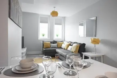 a living room with a table with wine glasses on it at S/KING BED ONE BEDROOM FLAT in Brentwood