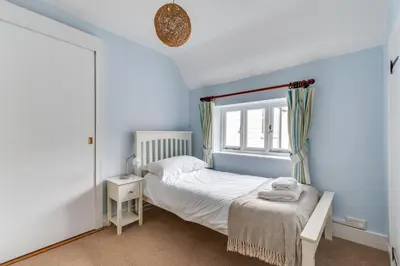 a small bedroom with a bed and a window at 3 Bed in Aldeburgh oc-chfc in Aldeburgh