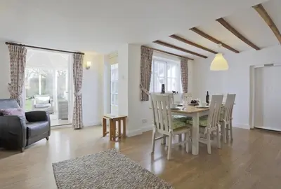 a living room with a dining room table and chairs at 3 Bed in Aldeburgh oc-chfc in Aldeburgh