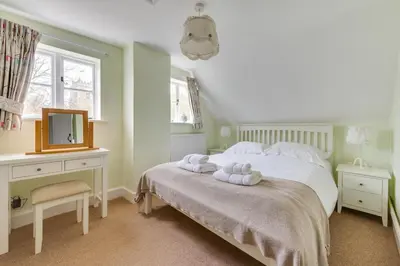 a bedroom with a bed with two towels on it at 3 Bed in Aldeburgh oc-chfc in Aldeburgh