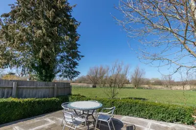 a table and chairs sitting on a patio at 3 Bed in Middleton oc-fdp in Middleton