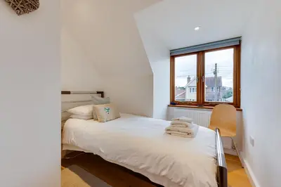 a small bedroom with a bed and a window at 2 Bed in Sudbury oc-clo in Sudbury