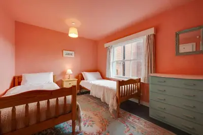 a bedroom with two beds and a window at 3 Bed in Aldeburgh oc-marg in Aldeburgh