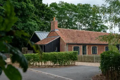 an old brick house with a fence in front of it at 3 Bed in Snape oc-1wadd in Snape