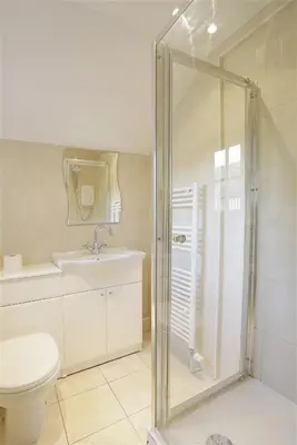 a bathroom with a shower and a toilet and a sink at 5 Bed in Thorpeness oc-whin2 in Thorpeness