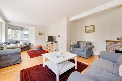 a living room with a couch and a table at 5 Bed in Thorpeness oc-whin2 in Thorpeness