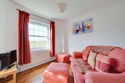 a living room with a couch and a tv at 3 Bed in Belchamp Otten oc-2mf in Belchamp Otten