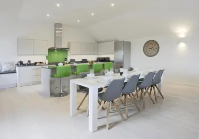 a kitchen with a white table and chairs at 3 Bed in Snape oc-2wadd in Snape