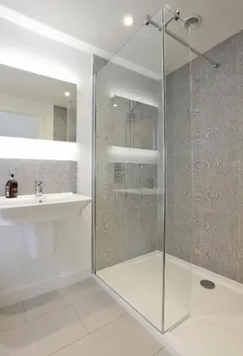 a bathroom with a glass shower and a sink at 3 Bed in Snape oc-2wadd in Snape