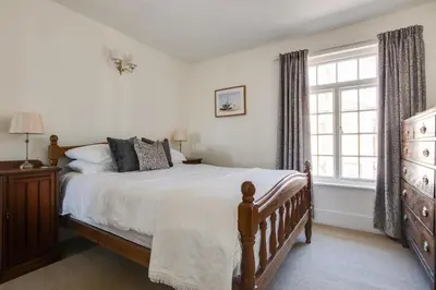 a bedroom with a large bed and a window at 2 Bed in Aldeburgh oc-prd in Aldeburgh