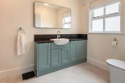 a bathroom with a sink and a mirror at 3 Bed in Aldeburgh oc-9king in Aldeburgh