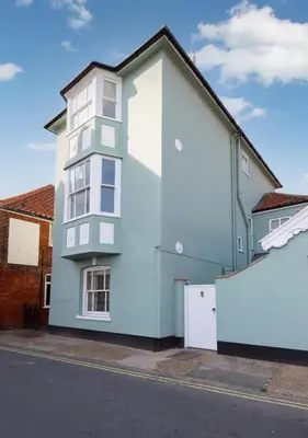 a blue and white building on the side of a street at 3 Bed in Aldeburgh oc-9king in Aldeburgh
