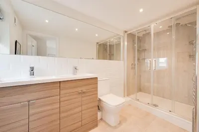 a bathroom with a toilet sink and a shower at 3 Bed in Aldeburgh oc-9king in Aldeburgh