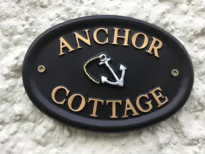 a black and gold sign that says anchor exchange at 3 Bed in Woodbridge oc-acot in Woodbridge