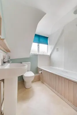 a bathroom with a sink and a toilet and a bath tub at 3 Bed in Woodbridge oc-acot in Woodbridge