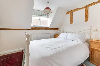 a bedroom with a white bed and a window at 3 Bed in Woodbridge oc-acot in Woodbridge