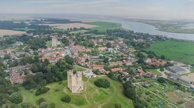 an aerial view of a town with a castle at 2 Bed in Orford oc-sfcto in Orford