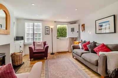 a living room with a couch and a chair at 2 Bed in Orford oc-sfcto in Orford