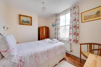 a bedroom with a bed and a window at 3 Bed in Aldeburgh oc-ahs in Aldeburgh