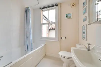 a bathroom with a tub and a toilet and a sink at 3 Bed in Aldeburgh oc-ahs in Aldeburgh