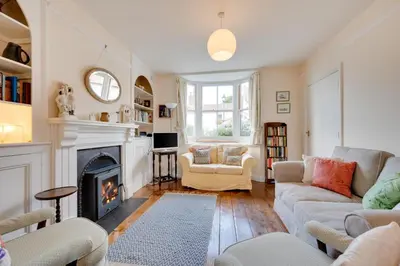 a living room with a fireplace and couches at 3 Bed in Aldeburgh oc-ahs in Aldeburgh