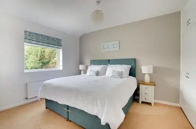 a bedroom with a large bed and a window at 3 Bed in Woodbridge oc-30mor in Woodbridge